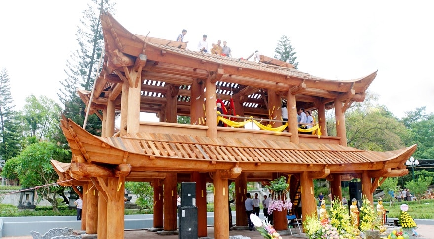 The triple gate and bell tower represent the fourth architectural component of the complex