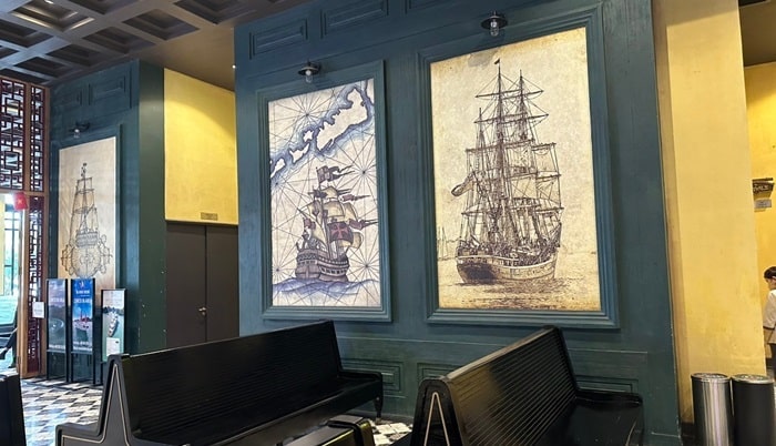 Terminal walls uniquely designed with 27 frames featuring ancient nautical charts and vintage sailing ships