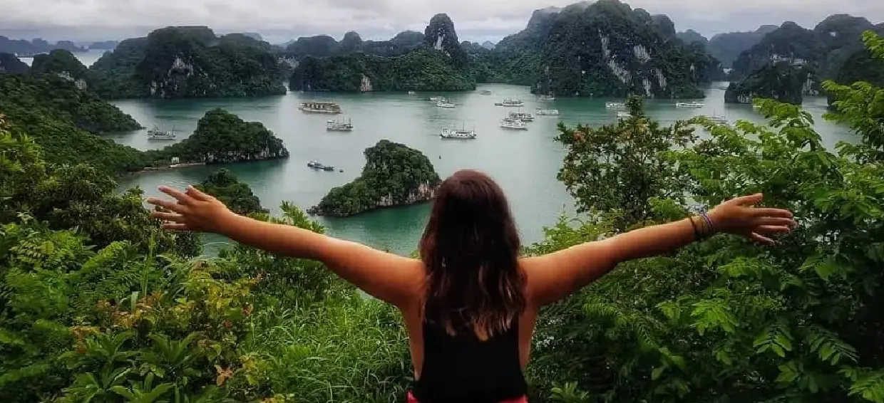 Hiking up Titov Island to admire the panoramic view of Halong Bay from above is an exciting experience during the 8-hour Halong Bay tour